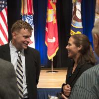 Audrey Goral speaks with a member of the Cooke family after receiving her award