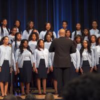 Spelman College choir sing for a group of people