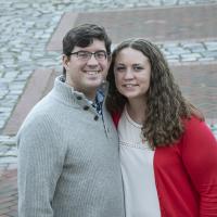 Newly engaged couple posing for a picture