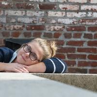 Young female posing for senior picture on location