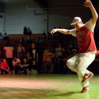 Young male breakdancing in a college competition