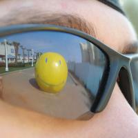 Reflection of giant smiley face statue in VA Beach, VA